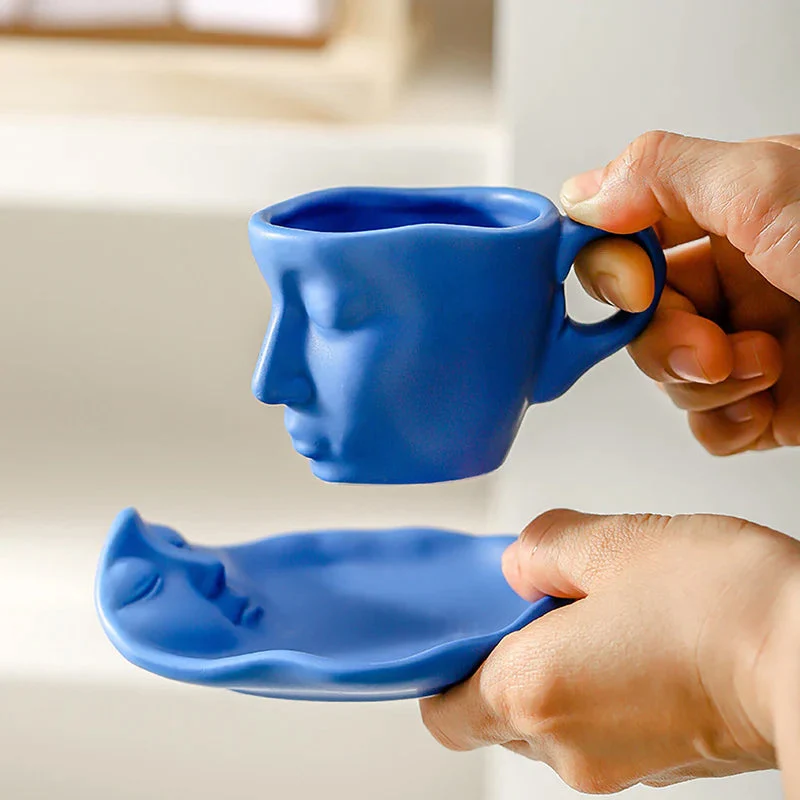 Skanto | Kyssnades Gesichts-Keramik-Kaffeetasse