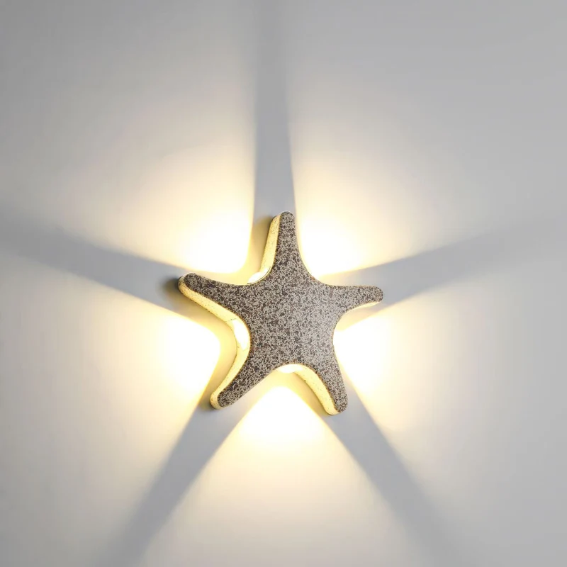 Skanto | Zeitgenössische schlichte LED-Wandleuchte im Seestern-Design aus Aluminium, wasserdicht für die Terrasse im Außenbereich