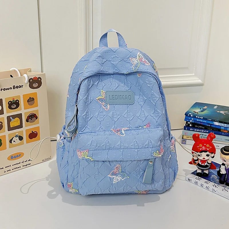 Bestickter Schulrucksack mit Blumenmotiv