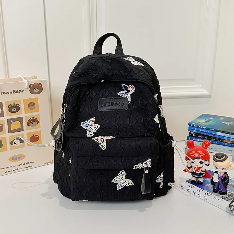 Bestickter Schulrucksack mit Blumenmotiv