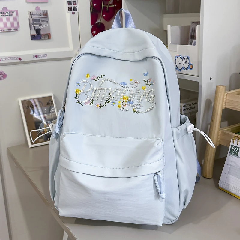 Schulrucksack mit bestickter Blume