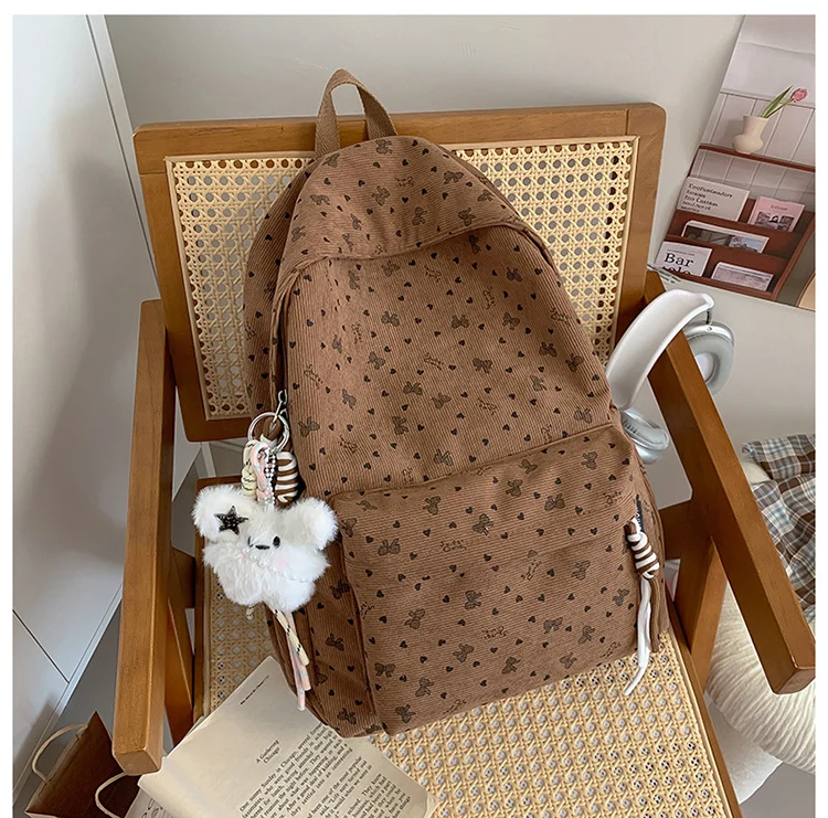 Niedlicher Schulrucksack mit dekorativem Muster