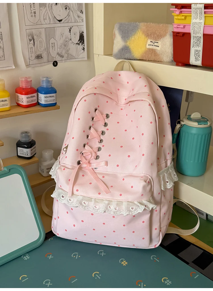 Schulrucksack mit Polka-Dot-Muster und Spitzenbesatz