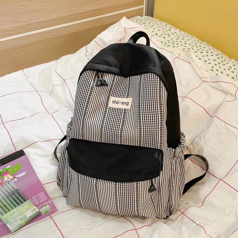 Vielseitiger karierter Schulrucksack