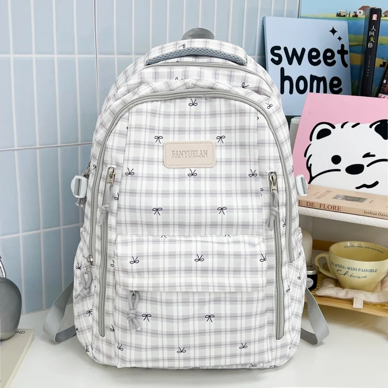 Süßer Schulrucksack mit Schleifenmuster