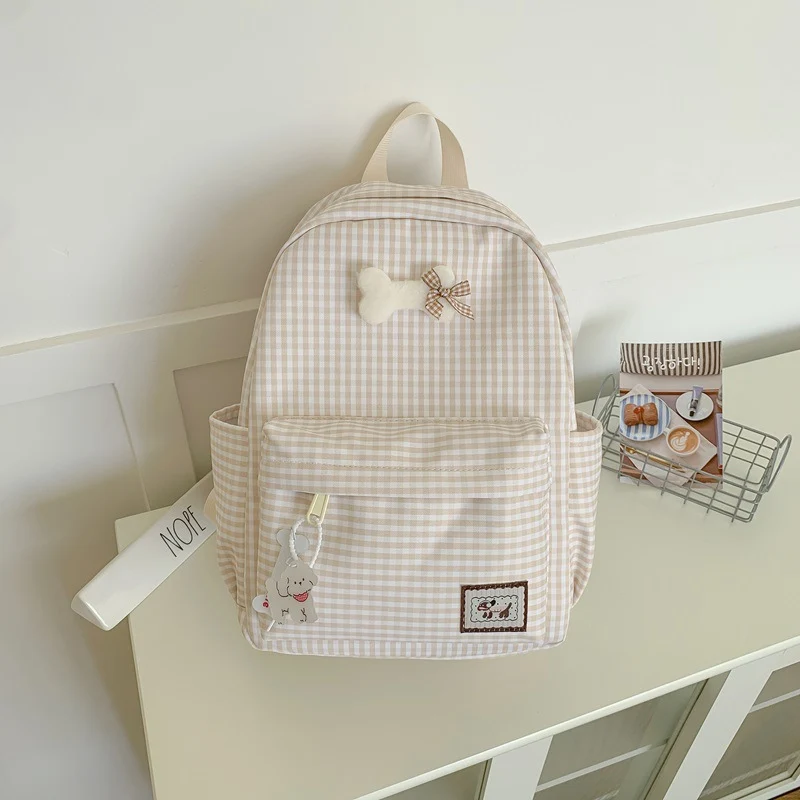 Niedlicher karierter Schulrucksack mit Charakter-Motiv