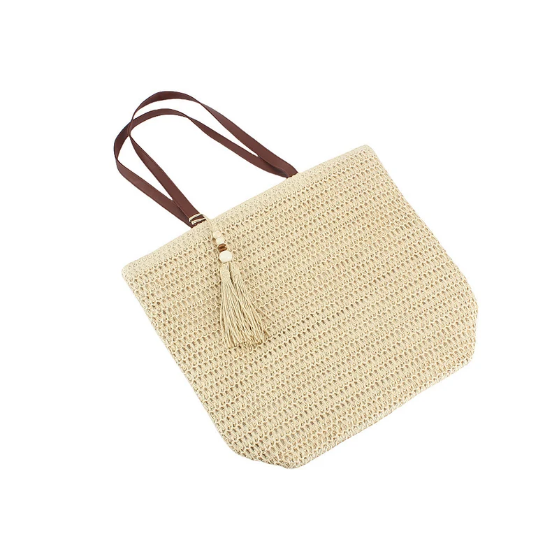 Geräumige Clutch aus geflochtenem Naturmaterial mit dekorativer Quaste Skanto