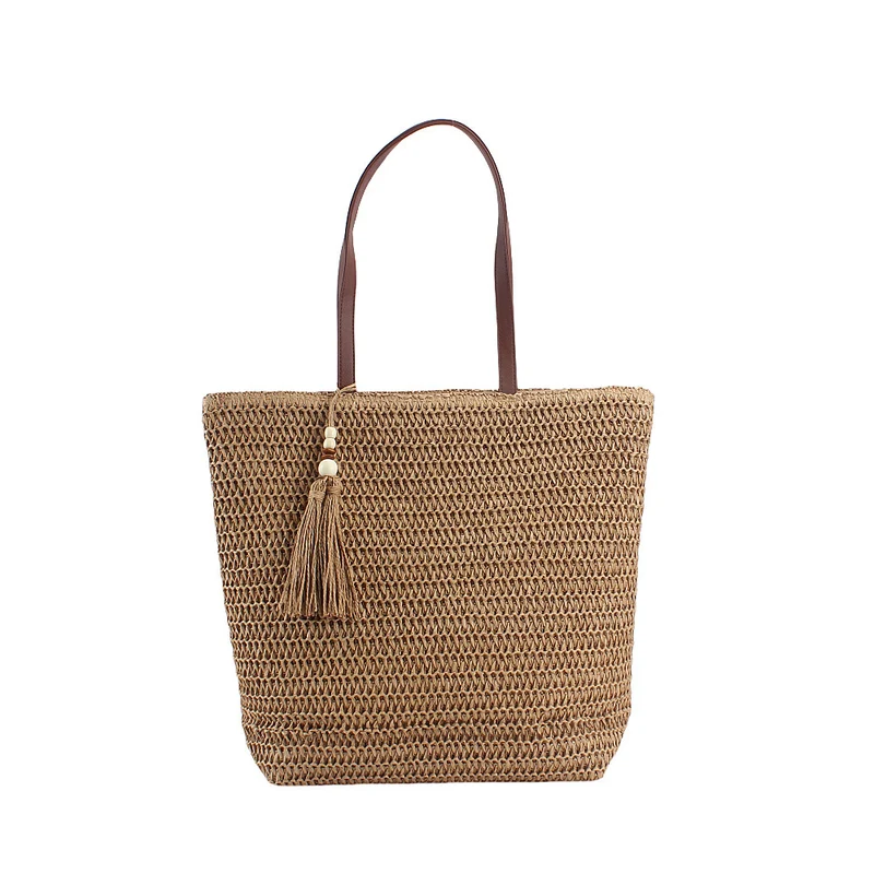 Geräumige Clutch aus geflochtenem Naturmaterial mit dekorativer Quaste Skanto