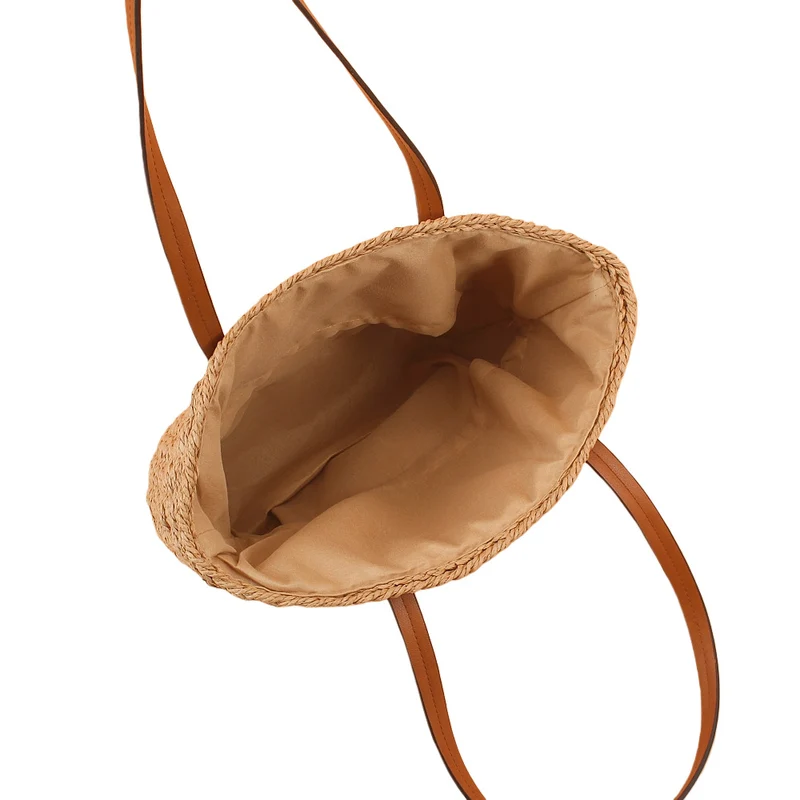Handtasche aus handgeflochtenem Naturmaterial mit robusten Ledergriffen Skanto