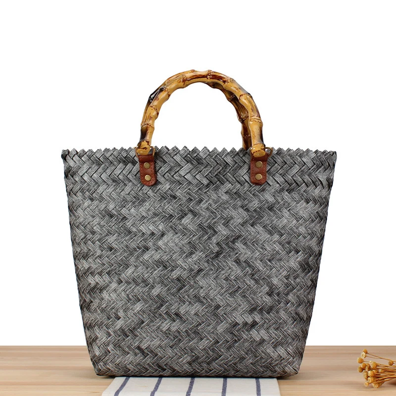 Handtasche aus hochwertigem, geflochtenem Material mit Bambusgriff Skanto