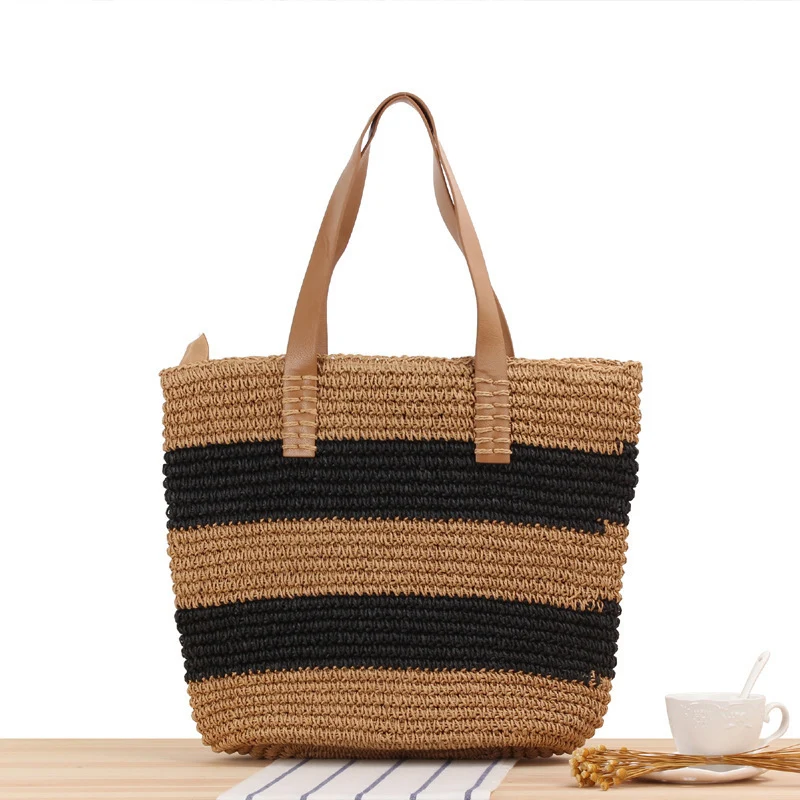 Breite Strohtasche mit eleganten Ledergriffen Skanto