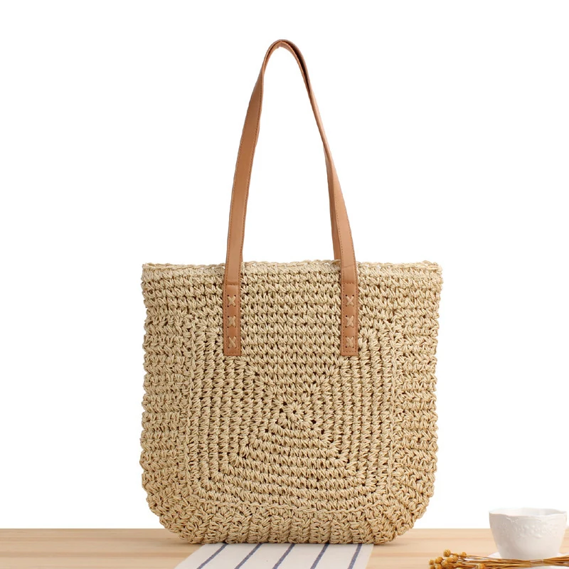 Tasche aus geflochtenem Naturmaterial mit weichen Ledergriffen Skanto