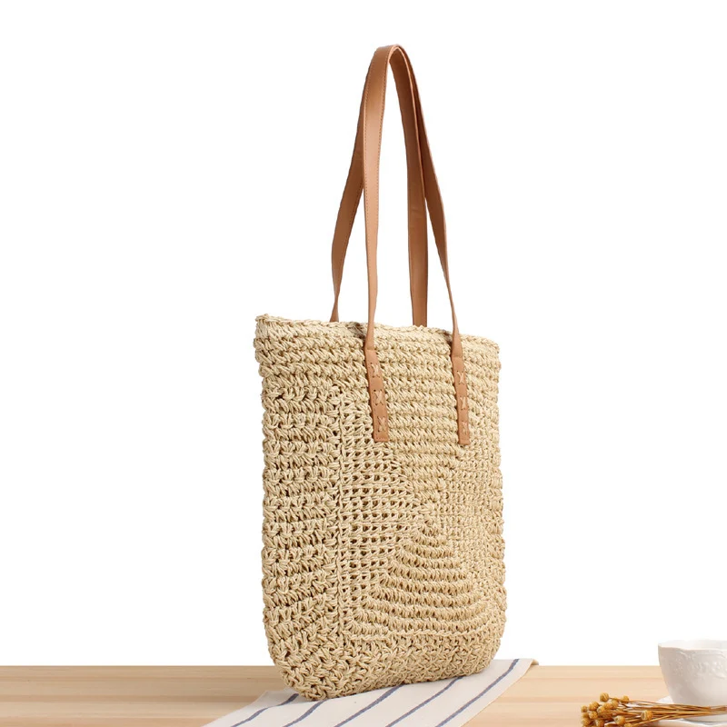 Tasche aus geflochtenem Naturmaterial mit weichen Ledergriffen Skanto