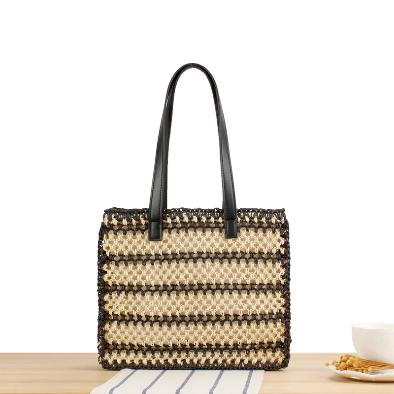 Handtasche mit robustem Flechtdesign und eleganten Ledergriffen Skanto