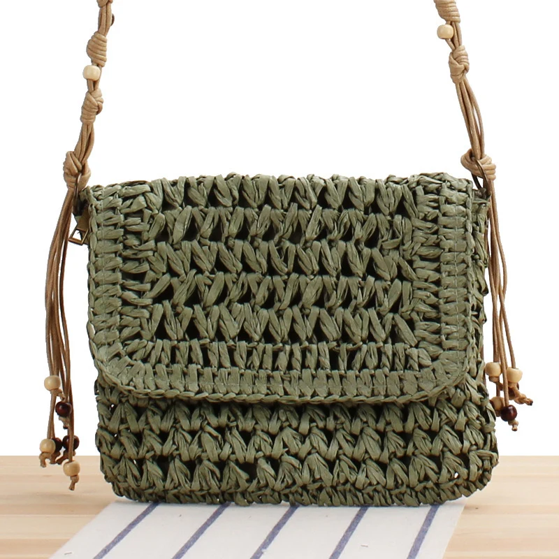 Handtasche aus geflochtenem Naturmaterial mit verspielten Fransen Skanto