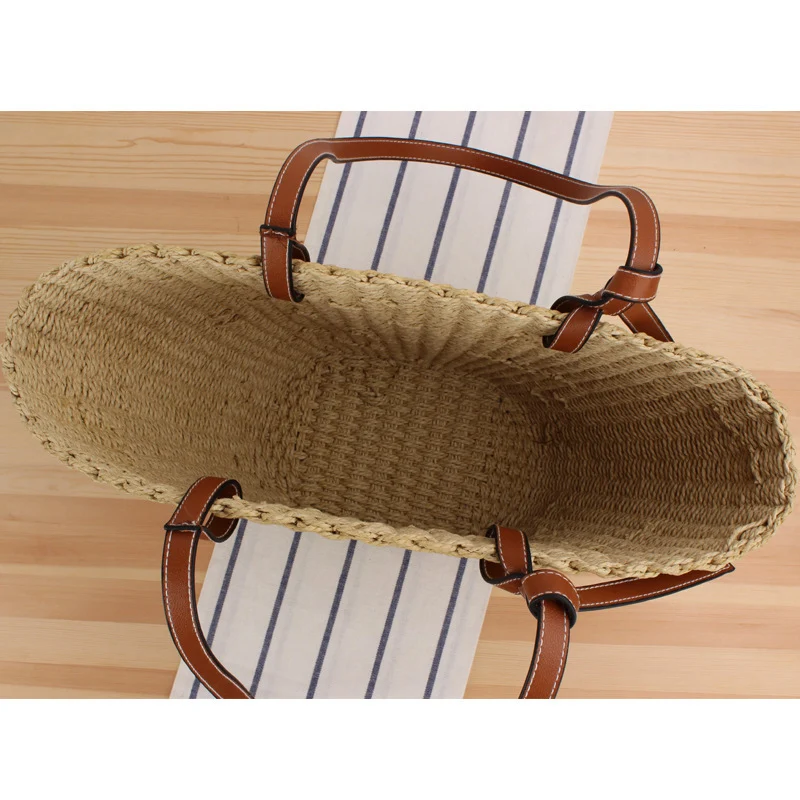 Handtasche aus geflochtenem Naturmaterial mit eleganten Ledergriffen Skanto
