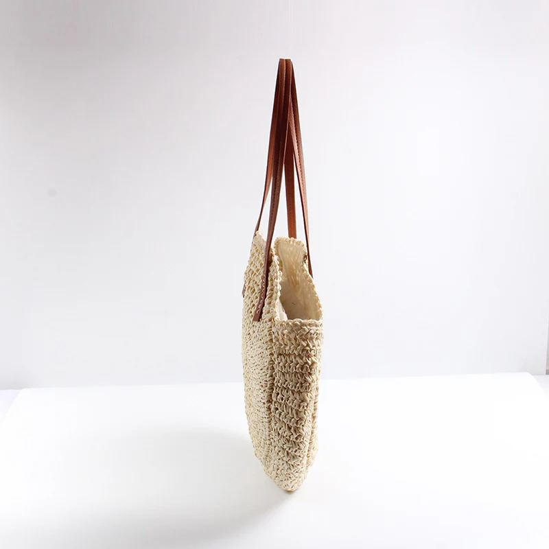 Runde Strohtasche mit eleganten Ledergriffen Skanto
