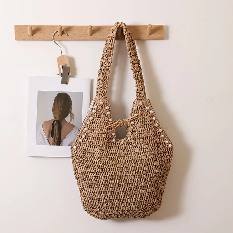 Handtasche mit Perlenverzierungen und innovativem Verschluss Skanto
