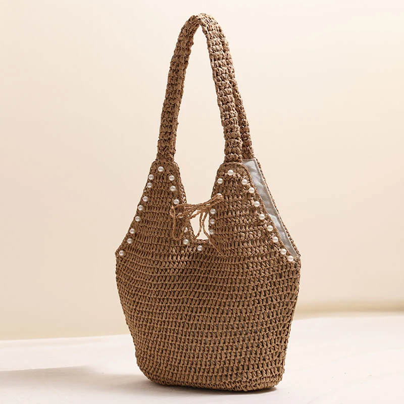 Handtasche mit Perlenverzierungen und innovativem Verschluss Skanto
