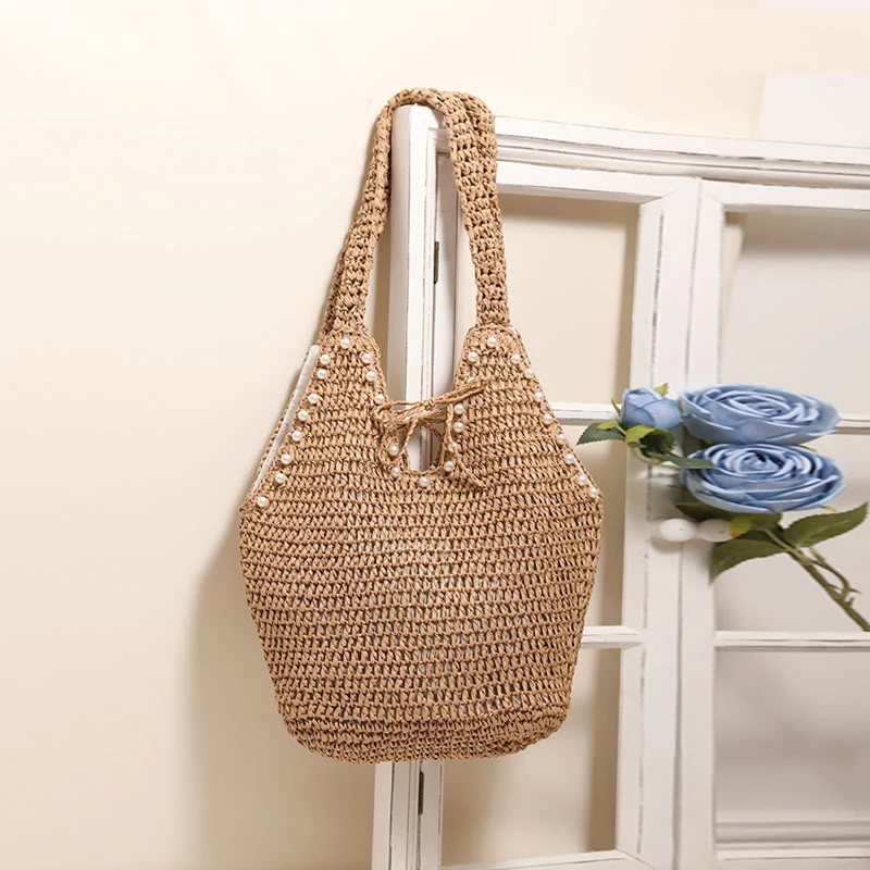 Handtasche mit Perlenverzierungen und innovativem Verschluss Skanto