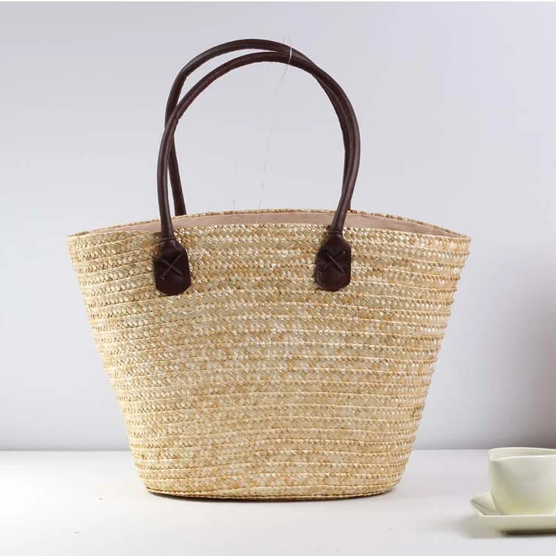 Geflochtene Strandtasche mit farbenfrohem Stickmuster Skanto