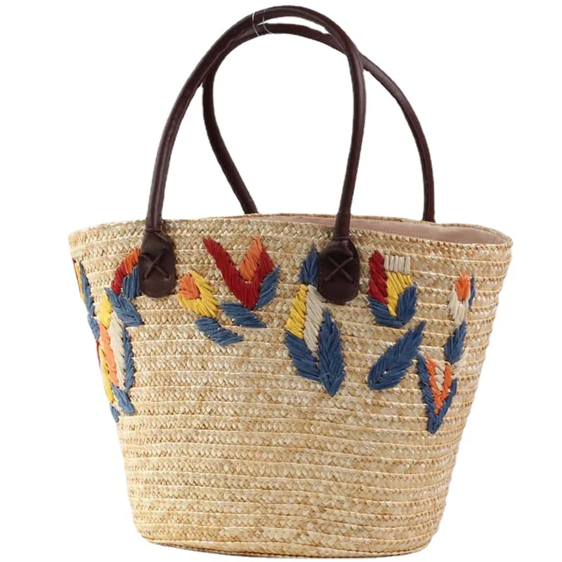 Geflochtene Strandtasche mit farbenfrohem Stickmuster Skanto