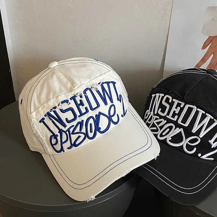 Damen bestickte Cap im Used-Look mit künstlerischem Motiv Skanto