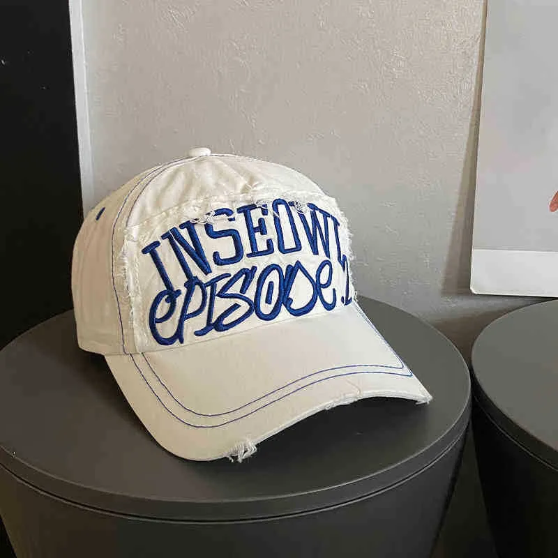 Damen bestickte Cap im Used-Look mit künstlerischem Motiv Skanto