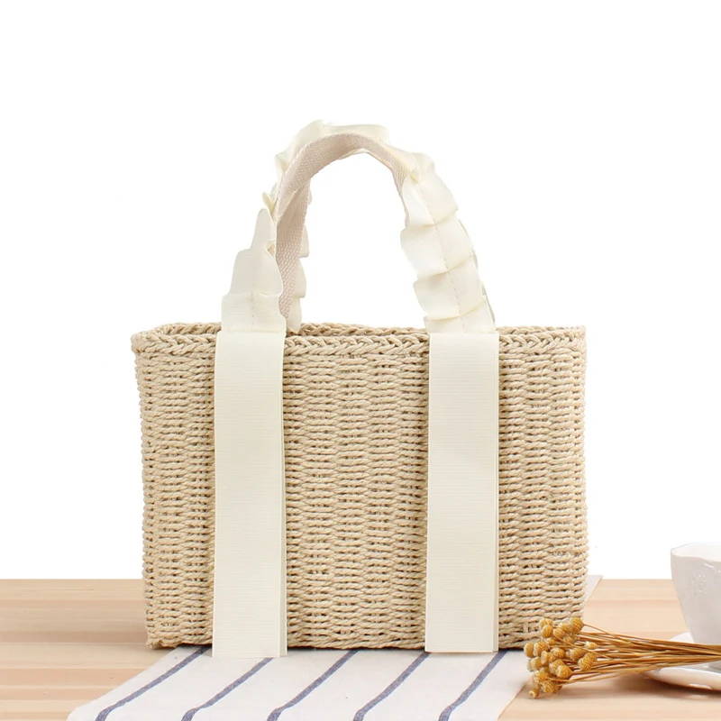 Geflochtene Handtasche mit eleganten Griffen Skanto