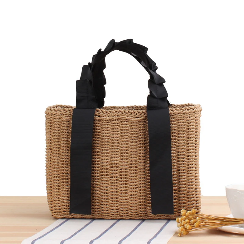 Geflochtene Handtasche mit eleganten Griffen Skanto
