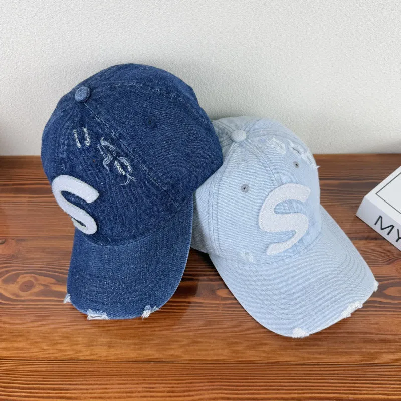 Damen Baseballkappe im Used-Look mit Grafik-Logo Skanto