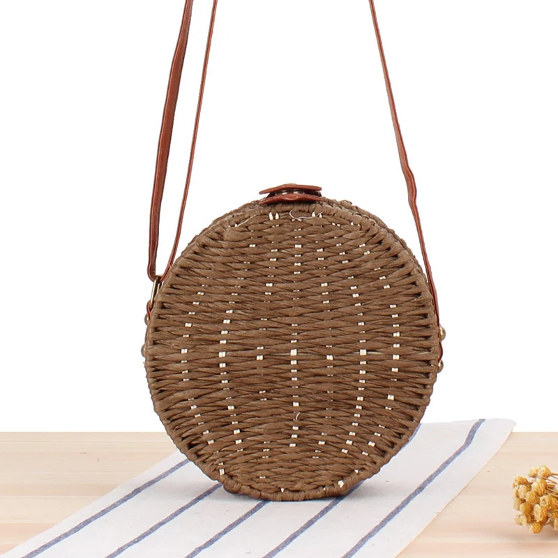 Runde gewebte Tasche mit Lederdetails Skanto