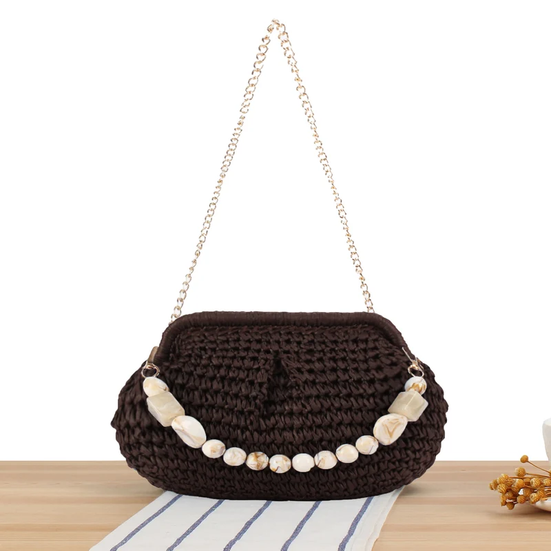 Geflochtene Clutch mit Perlenakzent Skanto