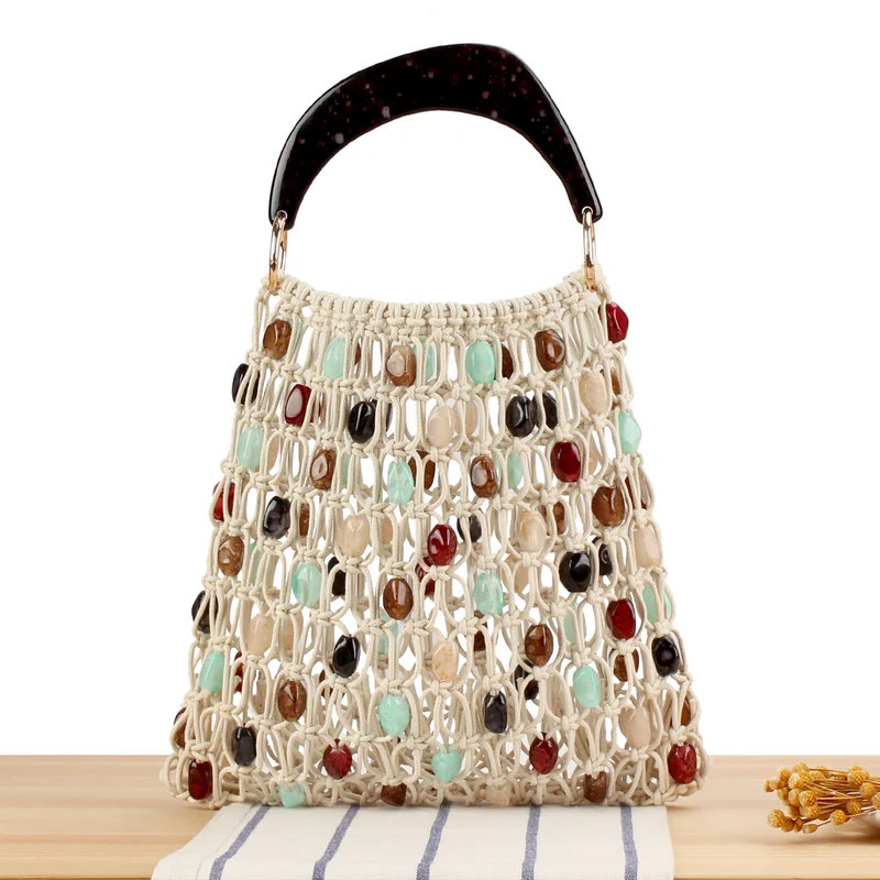 Modische Handtasche im kreativen Netzdesign mit farbigen Akzenten Skanto