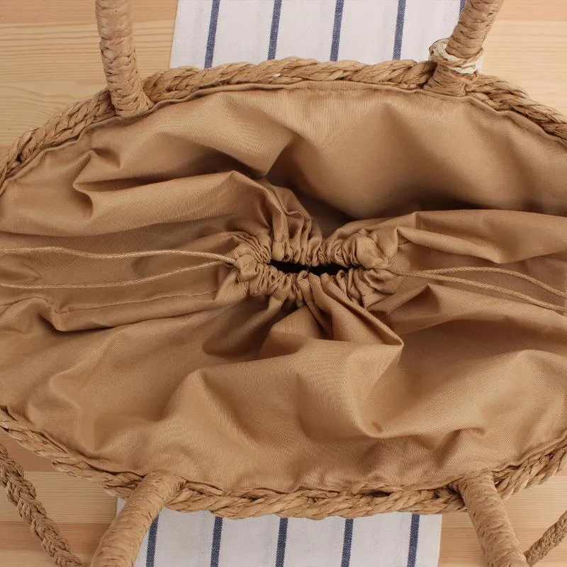 Elegante Bast-Umhängetasche mit Quasten und verstärktem Griff Skanto