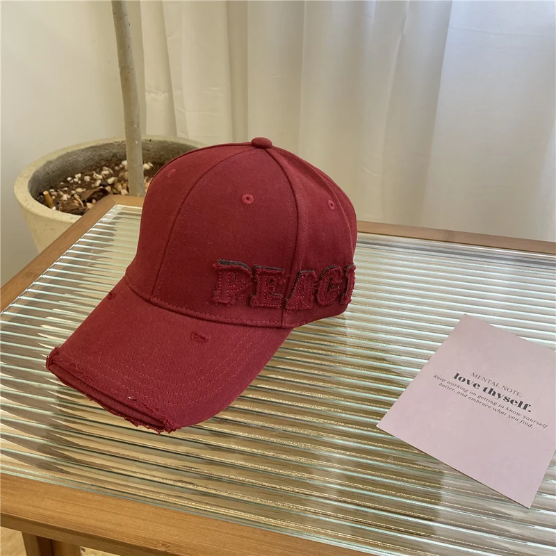 Damen Baseball Cap mit Peace-Grafik im Used-Look Skanto