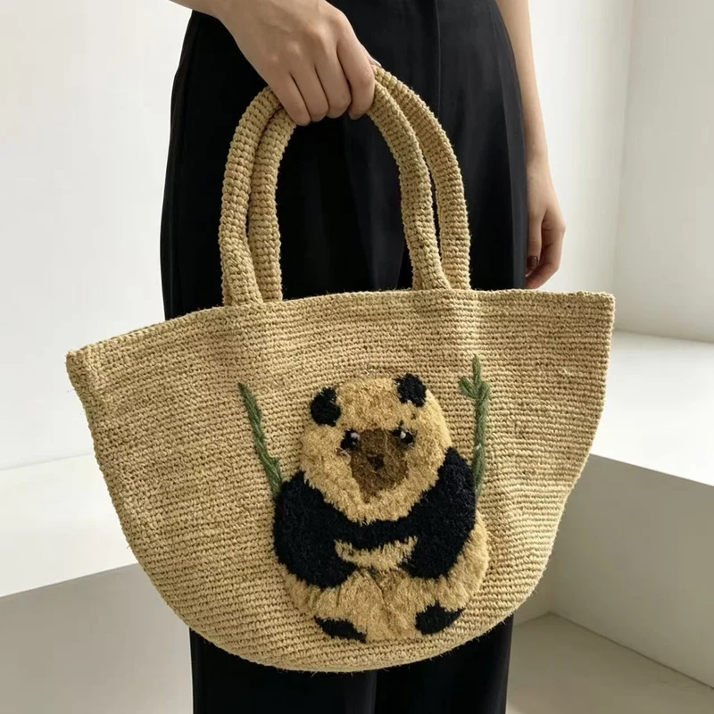 Südsee-inspirierte Korbtasche mit Panda-Motiv Skanto