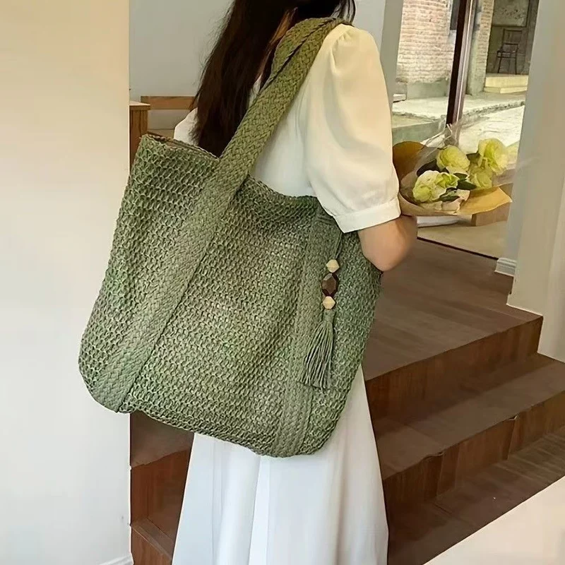 Natur gewebte Handtasche mit dekorativem Quastendetail Skanto