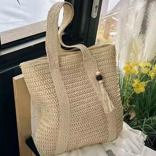 Natur gewebte Handtasche mit dekorativem Quastendetail Skanto